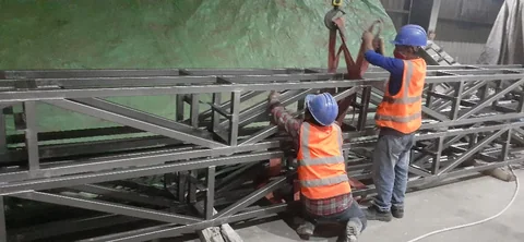 Steel members being handled for continued productive use